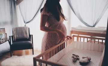 pregnant woman and crib