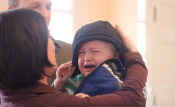 Mother Holding a Crying Toddler