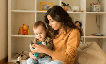 mom reading to baby