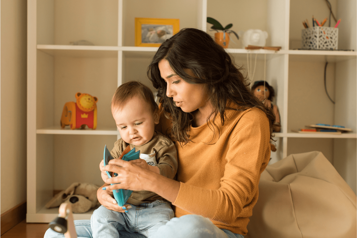 mom reading to baby