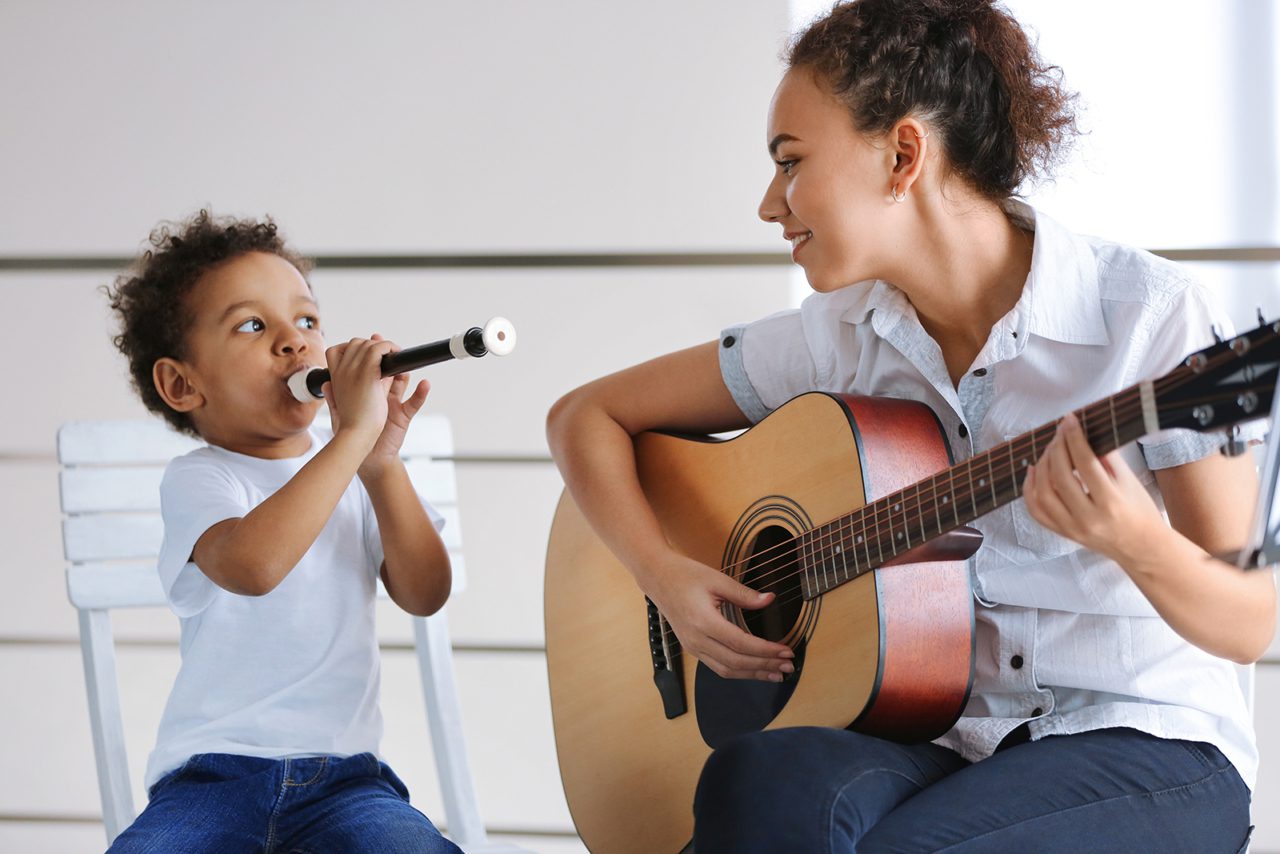 woman and child playing instruments