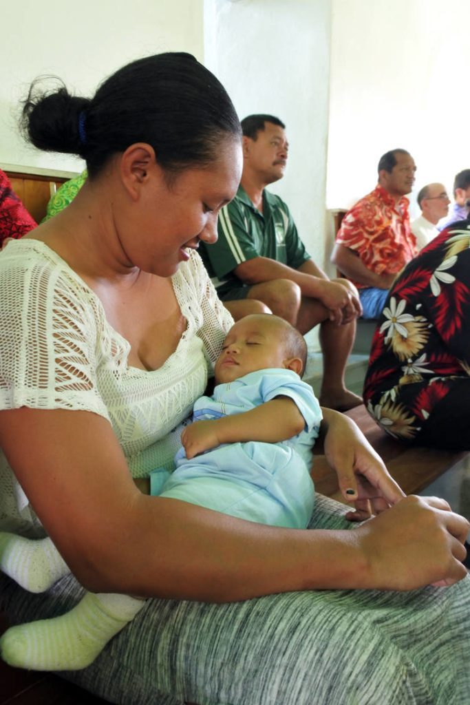Hawaiian mother with baby as they sleep