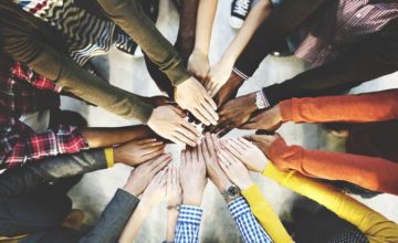 Group of hands in a circle