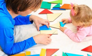 caregiver playing with toddlers