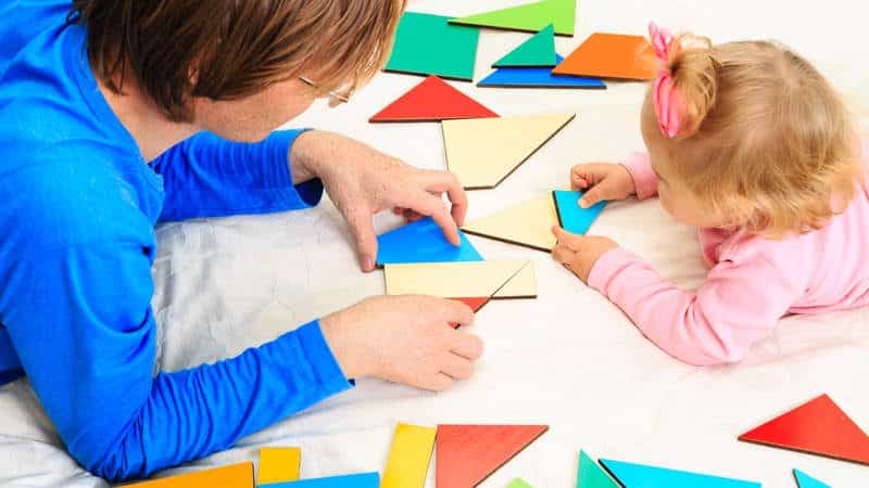 caregiver playing with toddlers