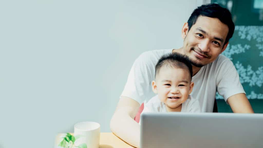 father and son at laptop