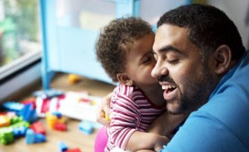 dad and baby cuddling
