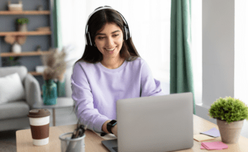 Woman smiling at laptop