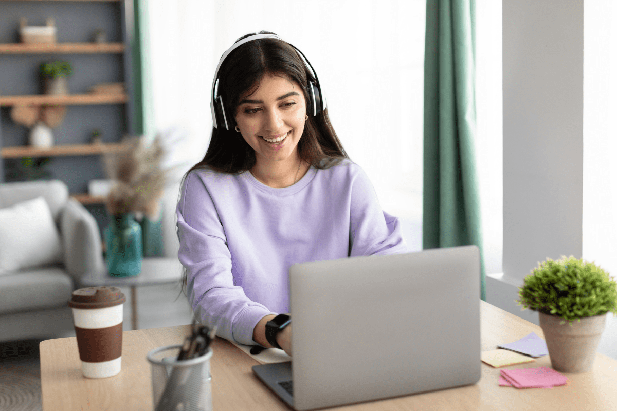 Woman smiling at laptop