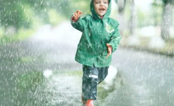 toddler playing in rain