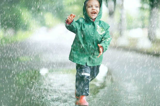 toddler playing in rain