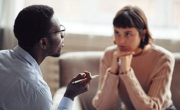 Man talking to early childhood professional