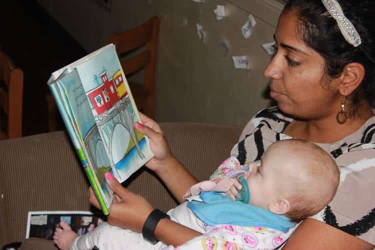 Teacher reading to a baby