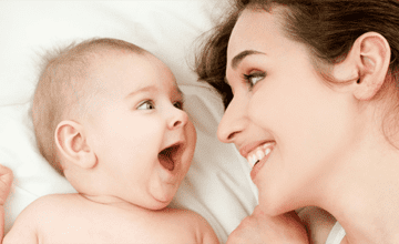 baby and smiling mother