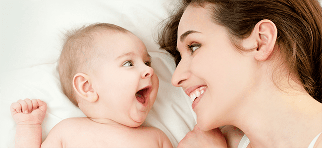 baby and smiling mother