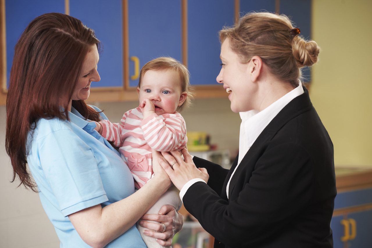 mother dropping daughter off at daycare