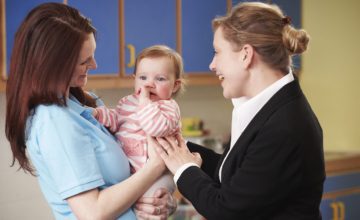 mother dropping daughter off at daycare