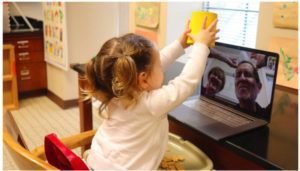 Toddler with grandparents laptop