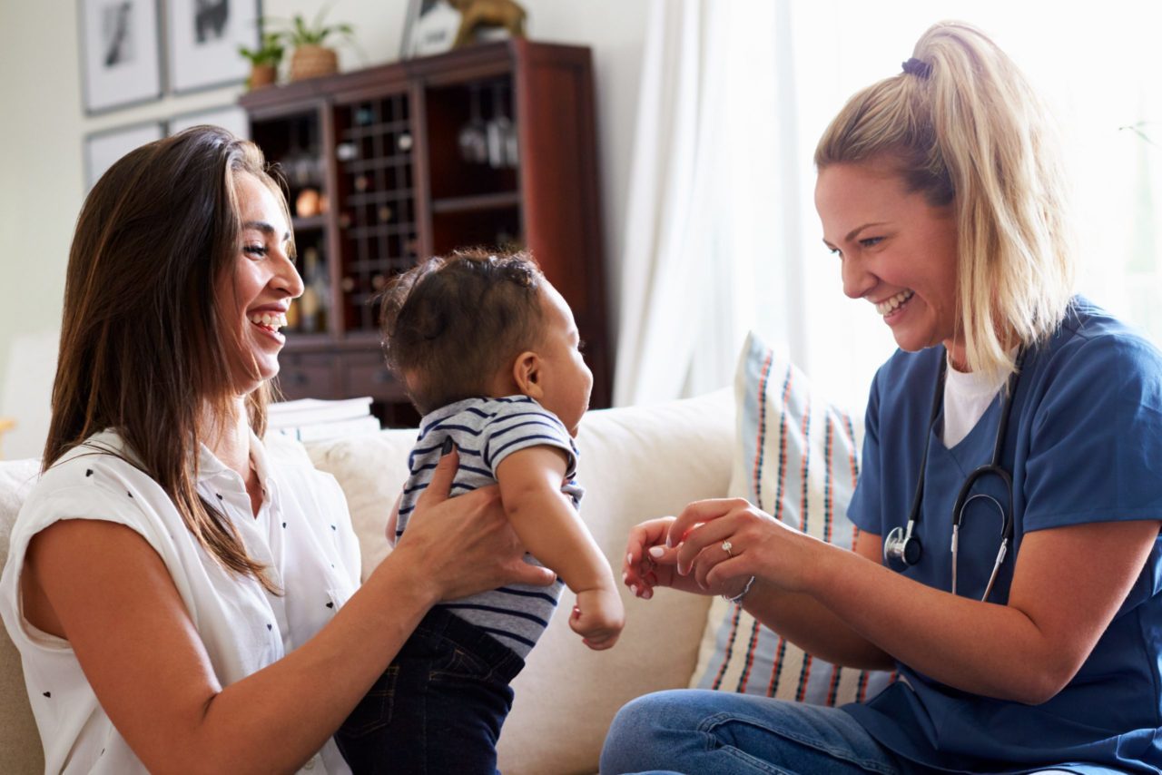 Home Visiting Nurse with infant and family