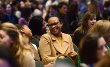 women sitting in audience at conference