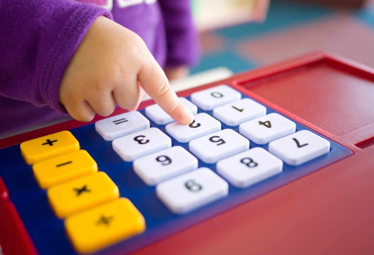 baby pressing calculator toy buttons