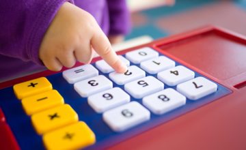 baby pressing calculator toy buttons