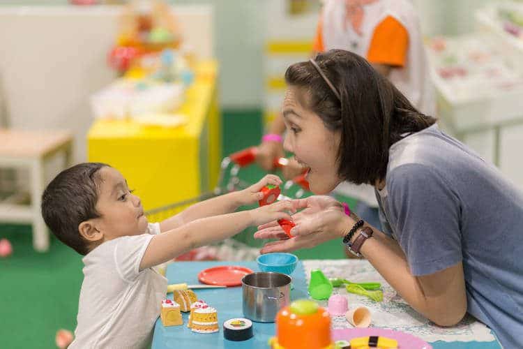 public pre-k instructor with child