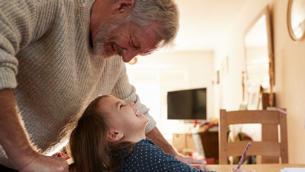 Grandfather and grandchild looking at each others eyes