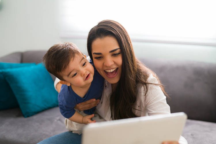 Mom and boy talking on laptop
