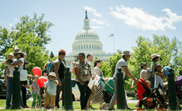 Families walking outside the white house