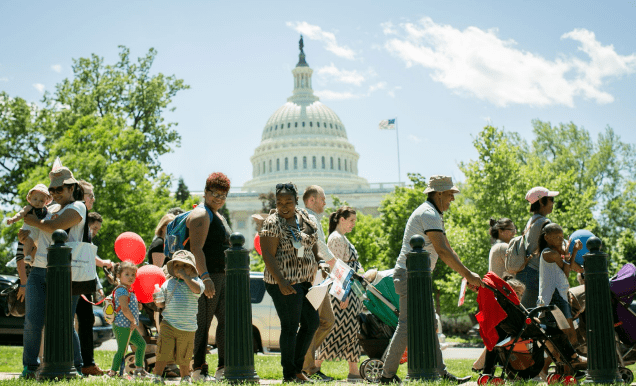 Families walking outside the white house