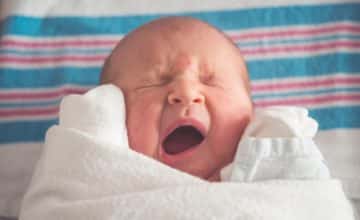 newborn baby yawning