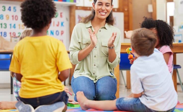 Sing and be happy. Shot of a teacher singing with her preschool children.