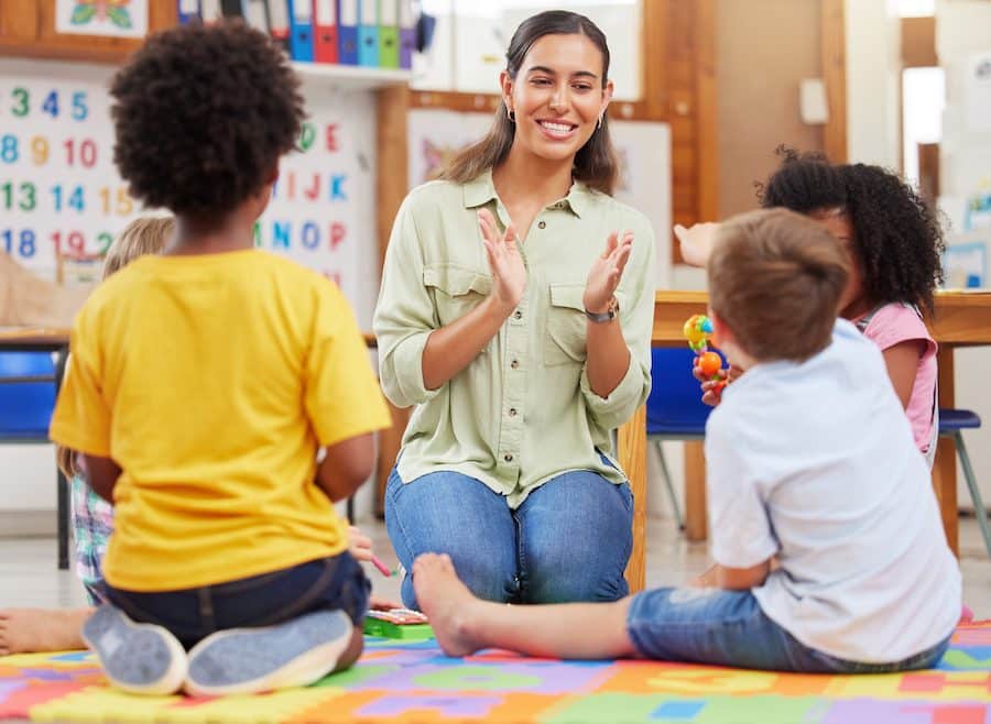 Sing and be happy. Shot of a teacher singing with her preschool children.