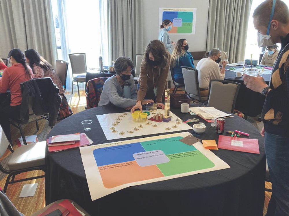 People working on posters at conference