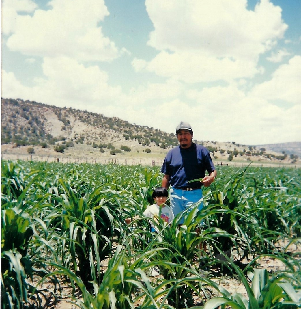 Carri's father in their family's cornfield.