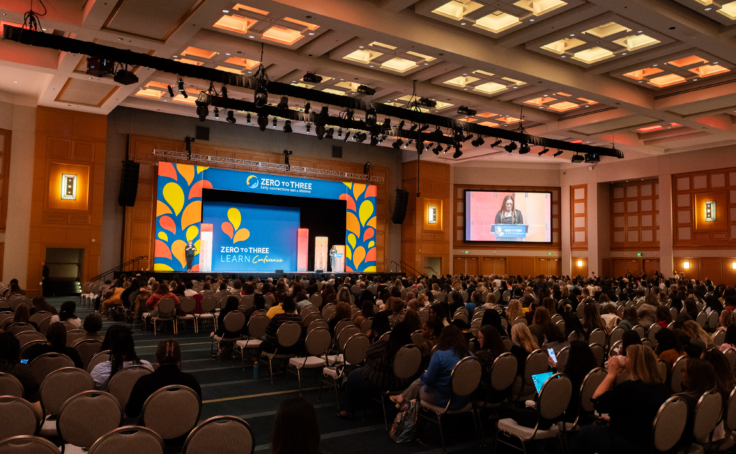 Photo of a large auditorium at early childhood conferences