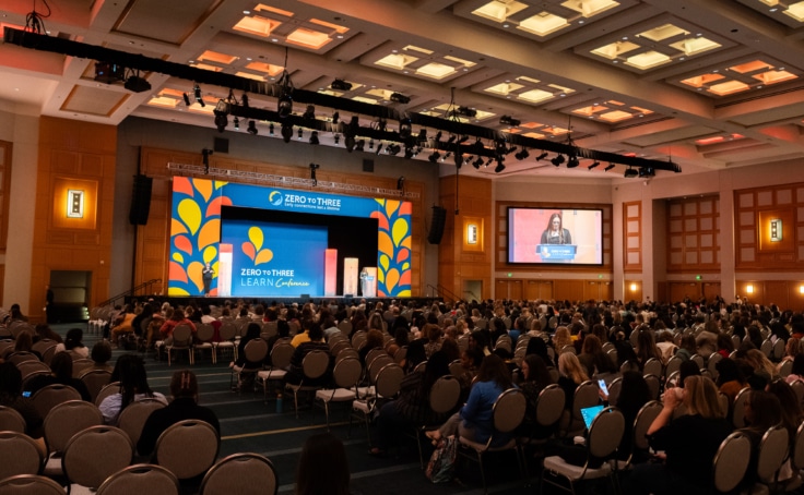 Photo of a large auditorium at early childhood conferences