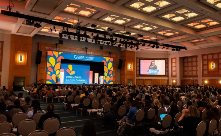 Photo of a large auditorium at early childhood conferences