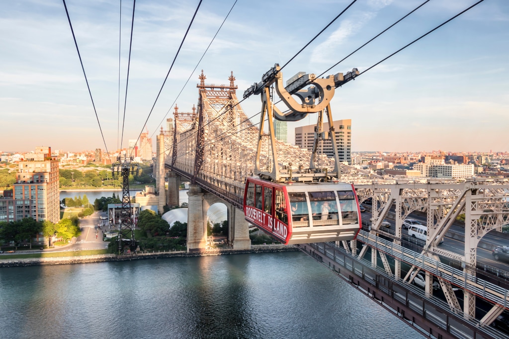 Aerial view of Roosevelt Island Tram over the Queensboro Bridge in New York City.