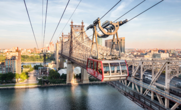 Aerial view of Roosevelt Island Tram over the Queensboro Bridge in New York City.