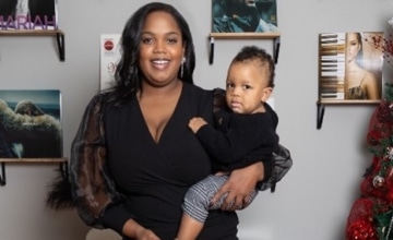 A photo of Rachell holding her baby boy Nazaire