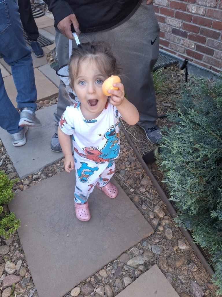 Bry's daughter holding an easter egg