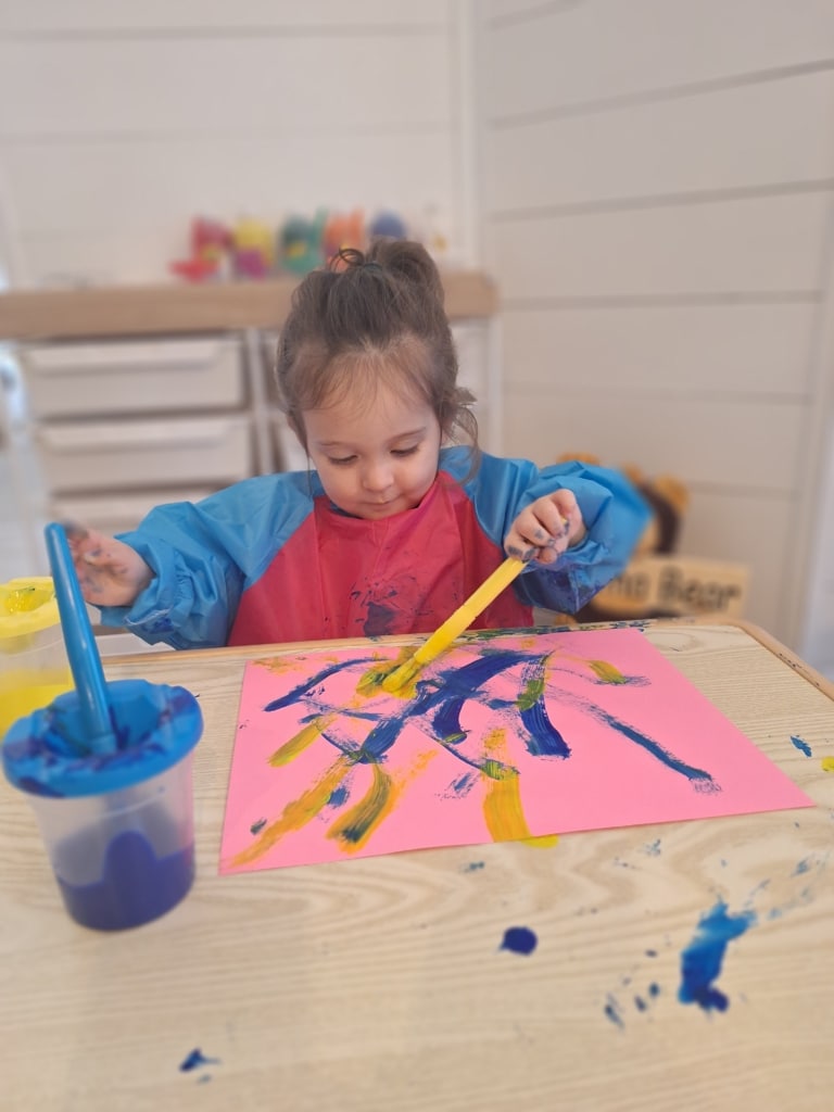 Bry's daughter painting a picture