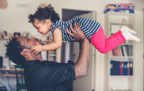 fatherhood A young fatherhood a father playing with his daughter