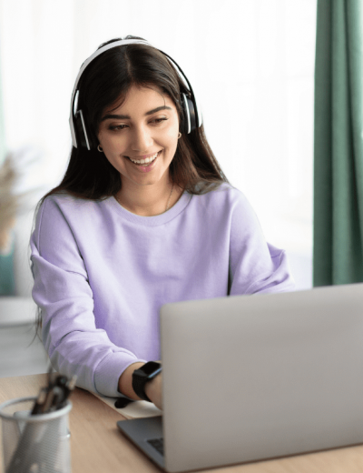 Woman smiling at laptop